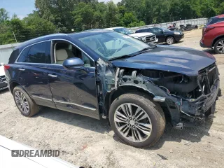 2017 Cadillac XT5 Premium Luxury AWD with VIN 1GYKNERS0HZ239805, listed as a Copart auction lot 61257435 with 104,448 mi miles and Salvage title. Bid and sale history available at DreamBid. Image 4.