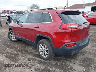 2014 Jeep Cherokee Latitude with VIN 1C4PJMCS0EW261021, listed as a IAAI auction lot 41986701 with 114,633 mi miles. Bid and sale history available at carsss.com. Image 3.