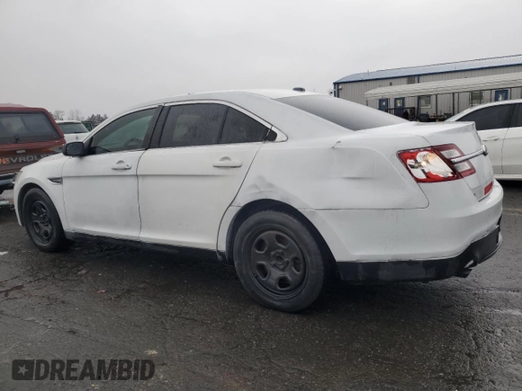 2014 Ford Police Interceptor with VIN 1FAHP2L83EG138213, listed as a Copart auction lot 83946044 with 130,742 mi miles and Salvage title. Bid and sale history available at DreamBid. Image 2.