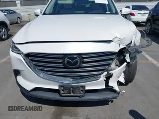 2019 Mazda CX-9 Touring with VIN JM3TCACY5K0306424, listed as a IAAI auction lot 42150466 with 95,166 mi miles and . Bid and sale history available at DreamBid. Image 12.