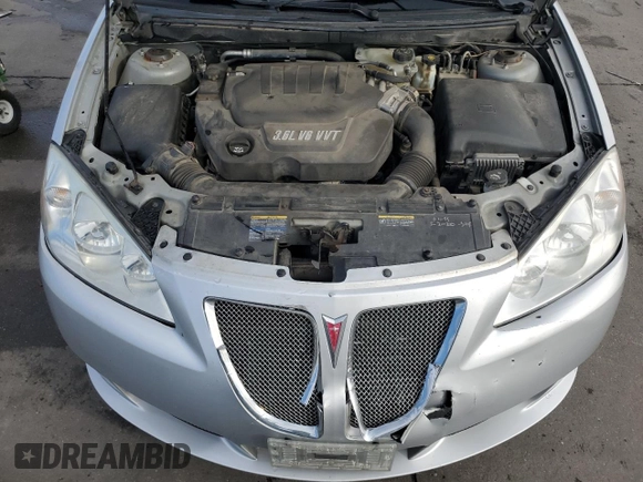 2009 Pontiac G6 with VIN 1G2ZL577094232011, listed as a Copart auction lot 77175054 with 133,353 mi miles and Salvage title. Bid and sale history available at DreamBid. Image 11.