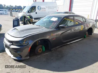 2019 Dodge Charger Scat Pack with VIN 2C3CDXGJ2KH564051, listed as a IAAI auction lot 41255283 with 64,687 mi miles and . Bid and sale history available at DreamBid. Image 18.