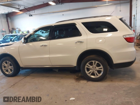 2013 Dodge Durango Crew with VIN 1C4RDHDG5DC553913, listed as a IAAI auction lot 42227189 with 209,703 mi miles and . Bid and sale history available at DreamBid. Image 14.