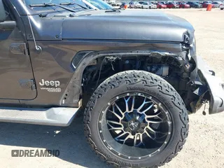 2018 Jeep Wrangler Unlimited Sport S с VIN 1C4HJXDN6JW277829, выставлен на аукционе IAAI как лот 42607187 с пробегом 107 461 миль миль и . История ставок и продаж доступна на DreamBid. Изображение 17.