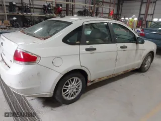 2009 Ford Focus SE with VIN 1FAHP35N59W180791, listed as a IAAI auction lot 42041573 with 201,464 mi miles. Bid and sale history available at carsss.com. Image 4.