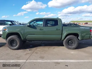 2021 Toyota Tacoma 4WD SR with VIN 3TMCZ5AN4MM401998, listed as a IAAI auction lot 41712813 with 91,371 mi miles. Bid and sale history available at carsss.com. Image 15.