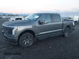 2023 Ford F-150 Lightning Pro z VIN 1FT6W1EV6PWG26596, wystawiony jako IAAI lot #40862334 z przebiegiem 13 857 mil mil oraz . Historia ofert i sprzedaży dostępna na DreamBid. Obrazek 2.