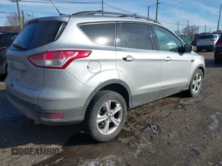 2013 Ford Escape SE with VIN 1FMCU9G98DUD51808, listed as a IAAI auction lot 41527022 with 141,471 mi miles. Bid and sale history available at carsss.com. Image 4.