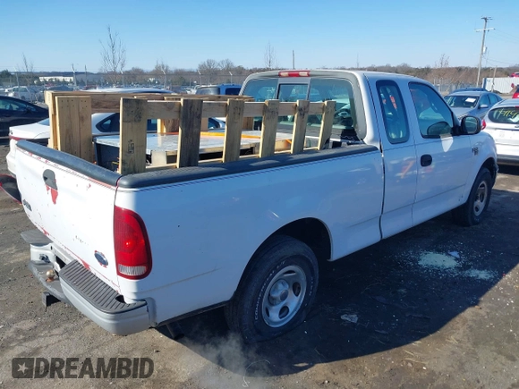 2000 Ford F-150 z VIN 2FTPX17L7YCA51774, wystawiony jako IAAI lot #41426958 z przebiegiem 421 412 mil mil oraz . Historia ofert i sprzedaży dostępna na DreamBid. Obrazek 4.