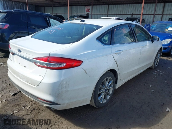 2017 Ford Fusion SE z VIN 3FA6P0H77HR277995, wystawiony jako IAAI lot #41586483 z przebiegiem 191 912 mil mil oraz . Historia ofert i sprzedaży dostępna na DreamBid. Obrazek 4.