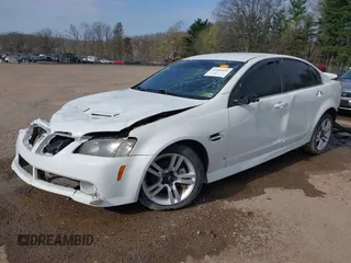 2009 Pontiac G8 with VIN 6G2ER57729L153123, listed as a IAAI auction lot 42046031 with 100,419 mi miles. Bid and sale history available at carsss.com. Image 2.