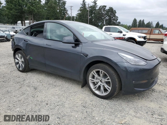 2024 Tesla Model Y Long Range with VIN 7SAYGDEE9RF069801, listed as a Copart auction lot 60857145 with 18,808 mi miles and Salvage title. Bid and sale history available at DreamBid. Image 4.
