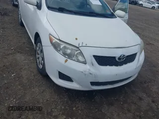 2009 Toyota Corolla with VIN JTDBL40E199019510, listed as a IAAI auction lot 40471286 with 99,818 mi miles and . Bid and sale history available at carsss.com. Image 6.