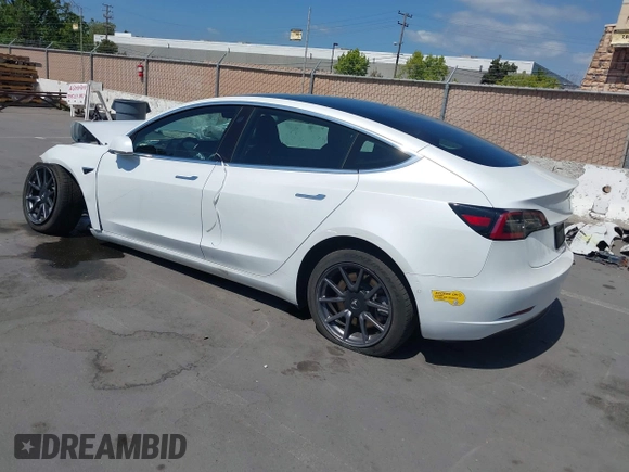 2020 Tesla Model 3 Standard Range Plus with VIN 5YJ3E1EAXLF590591, listed as a IAAI auction lot 42140338 with 79,342 mi miles and . Bid and sale history available at DreamBid. Image 3.