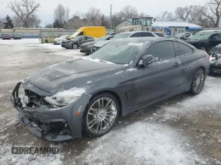 2015 BMW 4 Series 428i with VIN WBA3N3C54FK234451, listed as a Copart auction lot 87682265 with 69,504 mi miles and Salvage title. Bid and sale history available at DreamBid. Image 1.