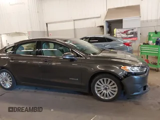 2016 Ford Fusion SE Hybrid with VIN 3FA6P0LU9GR235291, listed as a IAAI auction lot 41560312 with 112,777 mi miles. Bid and sale history available at carsss.com. Image 12.