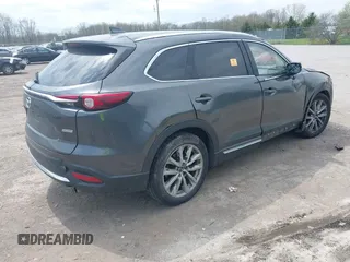 2016 Mazda CX-9 Grand Touring with VIN JM3TCBDY3G0117802, listed as a IAAI auction lot 42150821 with 157,760 mi miles and . Bid and sale history available at DreamBid. Image 4.