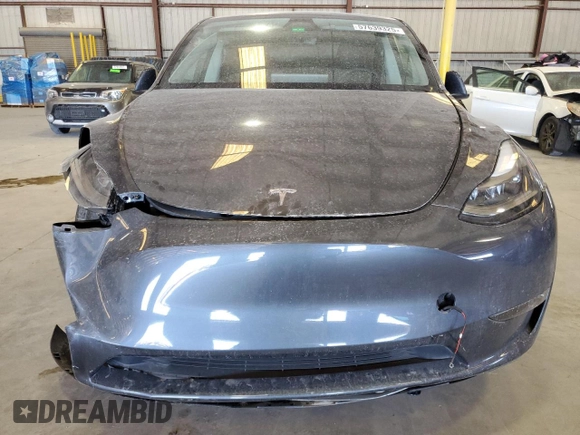 2023 Tesla Model Y Long Range z VIN 7SAYGDEE3PF862038, wystawiony jako Copart lot #57639325 z przebiegiem 11 020 mil mil oraz Szkoda całkowita • Salvage title. Historia ofert i sprzedaży dostępna na DreamBid. Obrazek 5.