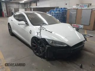 2014 Tesla Model S P85D with VIN 5YJSA1H23EFP63785, listed as a IAAI auction lot 41872168 with 118,248 mi miles and . Bid and sale history available at DreamBid. Image 1.