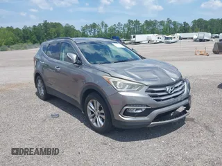 2018 Hyundai Santa Fe 2.0T z VIN 5NMZU4LAXJH057363, wystawiony jako IAAI lot #42265981 z przebiegiem 118 536 mil mil oraz . Historia ofert i sprzedaży dostępna na DreamBid. Obrazek 1.