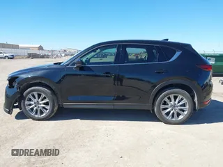 2020 Mazda CX-5 Grand Touring with VIN JM3KFBDMXL0763316, listed as a IAAI auction lot 41661958 with 64,881 mi miles and . Bid and sale history available at carsss.com. Image 15.