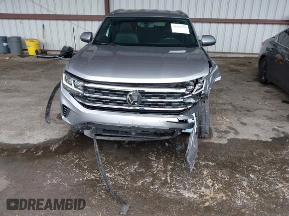 2023 Volkswagen Atlas SE z VIN 1V2HE2CA0PC222291, wystawiony jako IAAI lot #42431536 z przebiegiem 23 114 mil mil oraz . Historia ofert i sprzedaży dostępna na DreamBid. Obrazek 6.