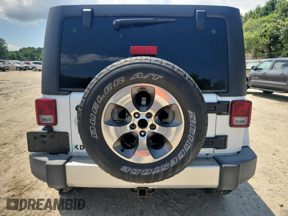 2016 Jeep Wrangler Unlimited Sahara с VIN 1C4HJWEG3GL346528, выставлен на аукционе Copart как лот 65092755 с пробегом 127 393 миль миль и Списание • Salvage title. История ставок и продаж доступна на DreamBid. Изображение 6.