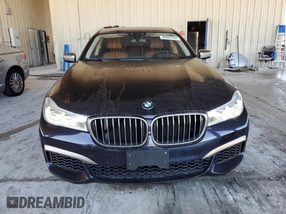 2019 BMW 7 Series M760i xDrive with VIN WBA7H6C55KG614986, listed as a Copart auction lot 84023164 with 59,222 mi miles and Non Repairable. Bid and sale history available at carsss.com. Image 5.
