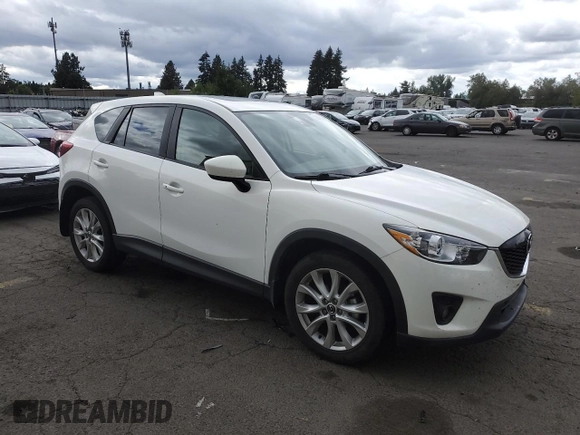 2014 Mazda CX-5 Grand Touring with VIN JM3KE4DY2E0354795, listed as a Copart auction lot 70713544 with 58,848 mi miles and Salvage Title. Bid and sale history available at DreamBid. Image 4.