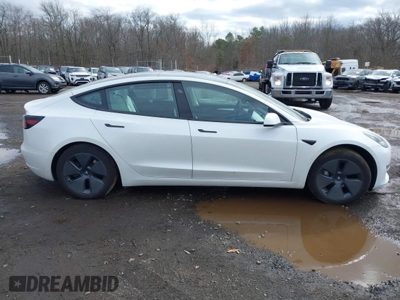2023 Tesla Model 3 z VIN 5YJ3E1EA8PF671613, wystawiony jako IAAI lot #41737438 z przebiegiem 21 405 mil mil oraz . Historia ofert i sprzedaży dostępna na DreamBid. Obrazek 13.