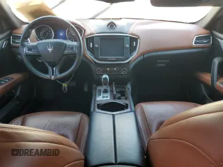 2014 Maserati Ghibli z VIN ZAM57XSA5E1081980, wystawiony jako Copart lot #53546905 z przebiegiem 60 019 mil mil oraz Tytuł czysty. Historia ofert i sprzedaży dostępna na DreamBid. Obrazek 8.