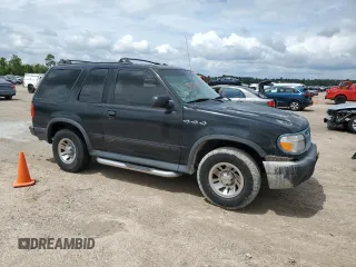 1999 Ford Explorer Sport z VIN 1FMYU22X9XUC03819, wystawiony jako Copart lot #69840564 z przebiegiem 214 315 mil mil oraz Szkoda całkowita • Salvage title. Historia ofert i sprzedaży dostępna na DreamBid. Obrazek 4.