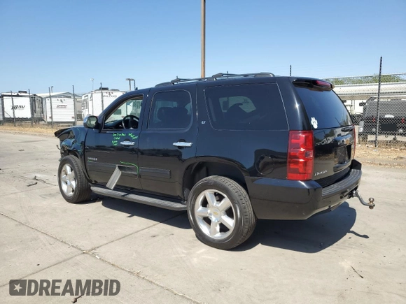 2014 Chevrolet Tahoe LT with VIN 1GNSCBE07ER115998, listed as a Copart auction lot 59577485 with 154,486 mi miles and Salvage title. Bid and sale history available at DreamBid. Image 2.