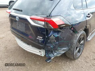 2021 Toyota RAV4 Hybrid XSE with VIN 4T3E6RFV0MU053245, listed as a IAAI auction lot 42426959 with 28,717 mi miles and . Bid and sale history available at DreamBid. Image 6.