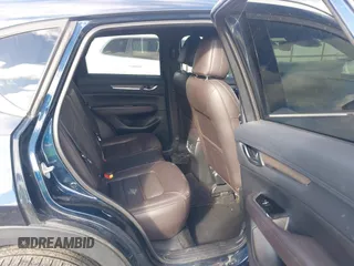 2019 Mazda CX-5 Signature with VIN JM3KFBEY5K0609063, listed as a IAAI auction lot 41802772 with 104,112 mi miles. Bid and sale history available at carsss.com. Image 8.