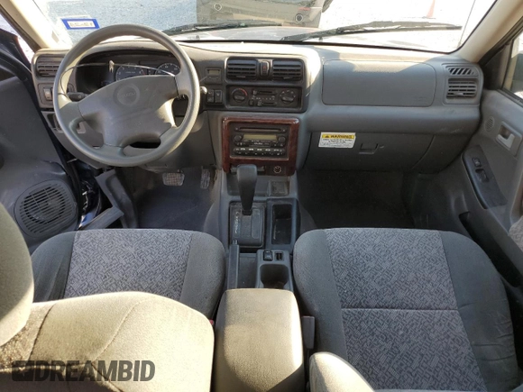 2002 Isuzu Rodeo S with VIN 4S2CK58W124307433, listed as a Copart auction lot 75447074 with 129,163 mi miles and Salvage title. Bid and sale history available at DreamBid. Image 8.
