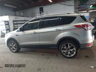 2015 Ford Escape Titanium z VIN 1FMCU9J96FUB23902, wystawiony jako IAAI lot #42497188 z przebiegiem 164 452 mil mil oraz . Historia ofert i sprzedaży dostępna na DreamBid. Obrazek 14.