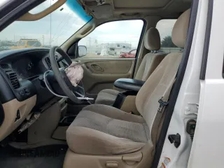 2003 Mazda Tribute LX with VIN 4F2CZ94123KM56293, listed as a Copart auction lot 65930574 with 175,150 mi miles and Salvage Title. Bid and sale history available at carsss.com. Image 7.