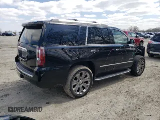 2015 GMC Yukon Denali with VIN 1GKS2CKJXFR702247, listed as a Copart auction lot 51648175 with 151,936 mi miles and Salvage Title. Bid and sale history available at carsss.com. Image 3.