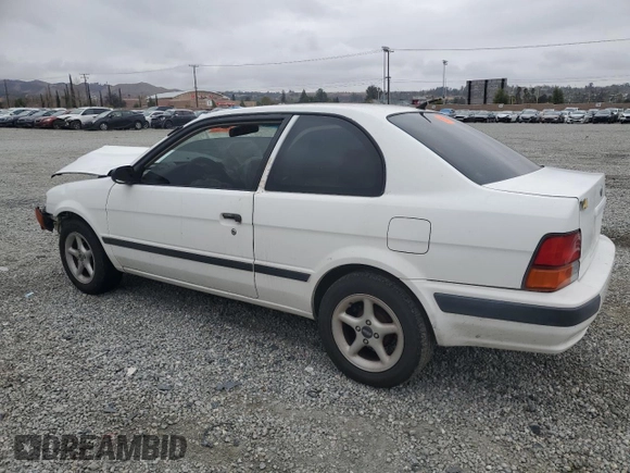 1996 Toyota Tercel DX z VIN JT2AC52L5T0145290, wystawiony jako Copart lot #45027855 z przebiegiem 186 673 mil mil oraz Szkoda całkowita • Salvage title. Historia ofert i sprzedaży dostępna na DreamBid. Obrazek 2.