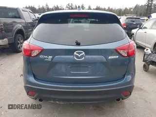 2015 Mazda CX-5 Touring with VIN JM3KE4CY1F0545305, listed as a IAAI auction lot 41234599 with 92,791 mi miles. Bid and sale history available at carsss.com. Image 16.