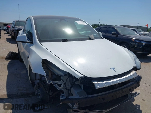 2021 Tesla Model Y Long Range with VIN 5YJYGDEE0MF265339, listed as a IAAI auction lot 41975058 with 51,292 mi miles and . Bid and sale history available at DreamBid. Image 6.