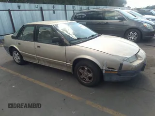 1994 Saturn SL z VIN 1G8ZF5591RZ223418, wystawiony jako IAAI lot #35065902 z przebiegiem 185 890 mil mil oraz . Historia ofert i sprzedaży dostępna na DreamBid. Obrazek 1.