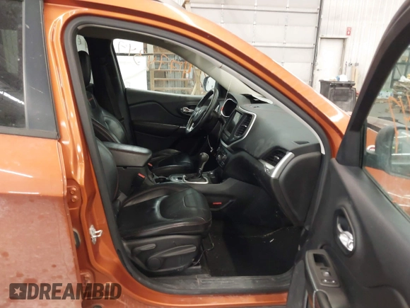 2015 Jeep Cherokee Trailhawk with VIN 1C4PJMBS5FW524462, listed as a IAAI auction lot 41774347 with 107,592 mi miles. Bid and sale history available at carsss.com. Image 5.