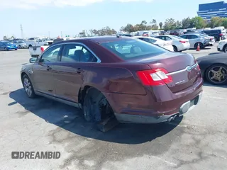 2011 Ford Taurus SEL with VIN 1FAHP2EW8BG137937, listed as a IAAI auction lot 42107586 with 143,525 mi miles. Bid and sale history available at carsss.com. Image 3.