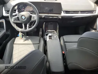 2024 BMW X1 xDrive28i with VIN WBX73EF06R5007063, listed as a Copart auction lot 56143075 with 2,947 mi miles and Salvage title. Bid and sale history available at DreamBid. Image 8.