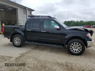 2011 Nissan Frontier Pro-4X with VIN 1N6AD0EVXBC433028, listed as a Copart auction lot 57653305 with 144,753 mi miles and Salvage title. Bid and sale history available at DreamBid. Image 4.