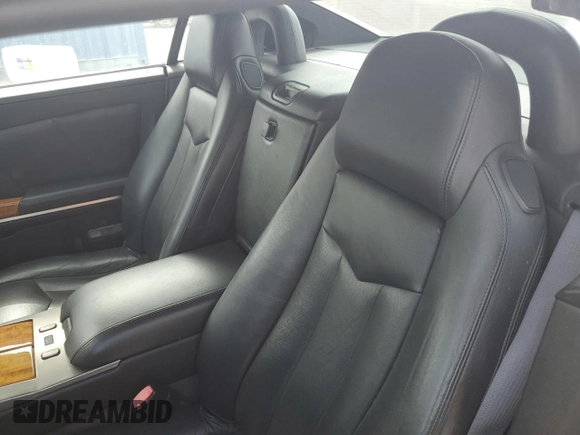 2004 Cadillac XLR z VIN 1G6YV34A945601007, wystawiony jako Copart lot #77077394 z przebiegiem Nie podano mil oraz Szkody całkowita. Historia ofert i sprzedaży dostępna na DreamBid. Obrazek 10.