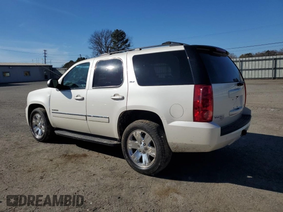 2013 GMC Yukon SLT with VIN 1GKS1CE05DR259086, listed as a Copart auction lot 42103305 with 130,079 mi miles and Salvage Title. Bid and sale history available at carsss.com. Image 2.