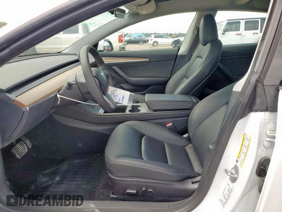 2023 Tesla Model 3 with VIN 5YJ3E1EA1PF550454, listed as a Copart auction lot 58985695 with 19,199 mi miles and Salvage title. Bid and sale history available at DreamBid. Image 7.